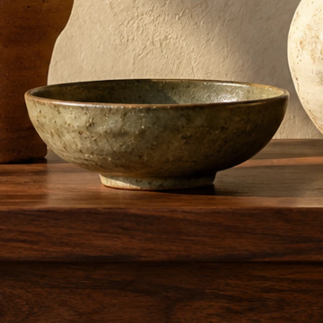 A wide Olive Bowl with a softly mottled green glaze